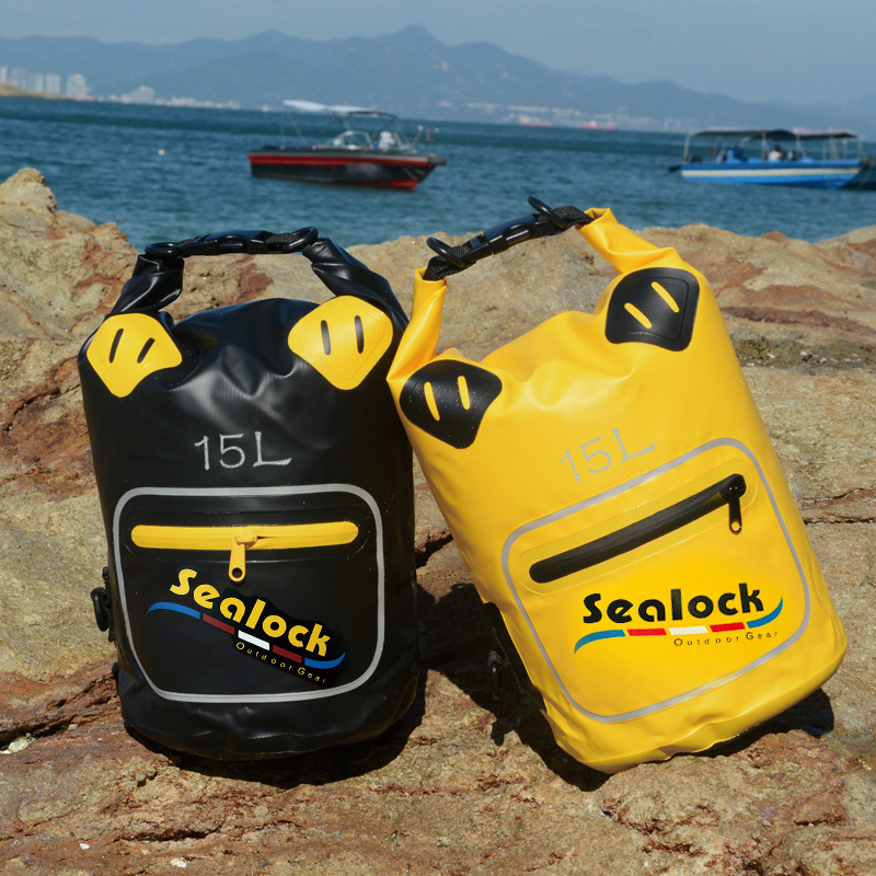 waterproof dry bag with transparent window at the beach